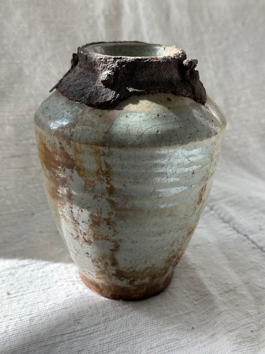 "one of a kind" ceramic vase with tarnished metal detail