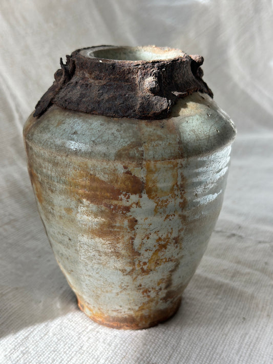 "one of a kind" ceramic vase with tarnished metal detail